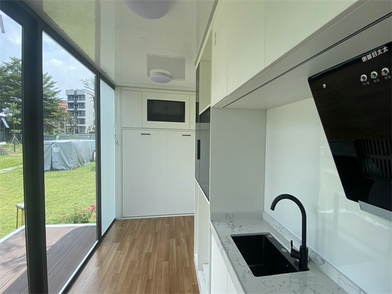 Collapsible galvanized steel bathroom with panoramic glass walls
