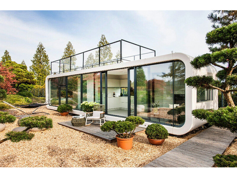 Self-contained glass prefab house approaches
